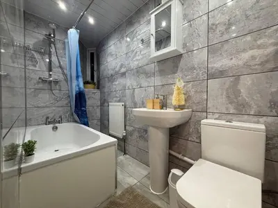 a bathroom with a tub and a toilet and a sink at Glasgow centre New property in Glasgow