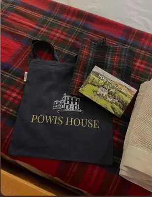 a bag sitting on top of a tartan blanket at Shepherds Hut on tranquil Powis House Estate in Stirling