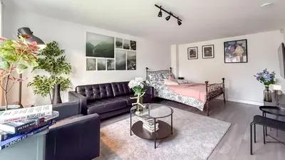 a living room with a couch and a table at New Modern Detached House with 5bdr Glasgow in Renfrew