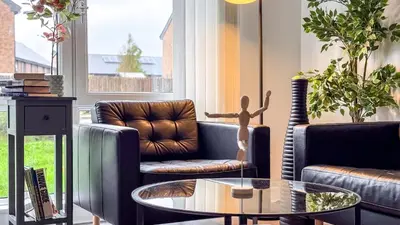a living room with couches and a coffee table at New Modern Detached House with 5bdr Glasgow in Renfrew