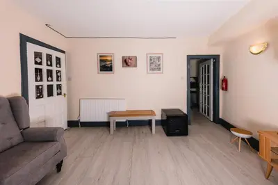 a living room with a couch and a table at Charming and Spacious City Getaway 3 in Edinburgh