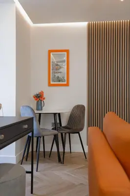 a dining room with a table and chairs at Old Kirk Apartment in Oban