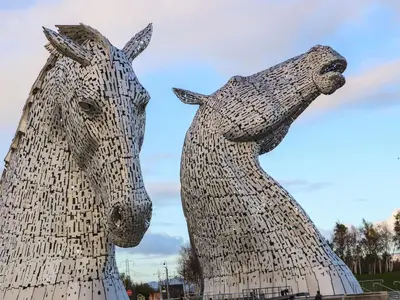 a statue of two horses standing next to each other at Beechtree Timber Lodge 69A in Denny