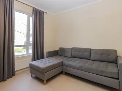 a living room with a couch and a window at Beechtree Timber Lodge 69A in Denny