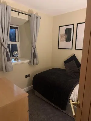 a bedroom with a bed and a window at Corner House, newly refurbished, Dunning in Dunning