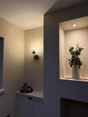a bathroom with a mirror and a vase with a plant at Corner House, newly refurbished, Dunning in Dunning