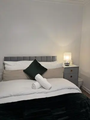 a bed with two pillows on top of it at The Telford Nook in Edinburgh