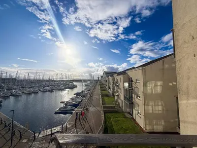 a view of a river with boats in a harbor at Marina View Apartment with Balcony & Sea Views in Horse Isle