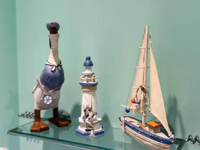 a shelf with three toy boats on it at Marina View Apartment with Balcony & Sea Views in Horse Isle