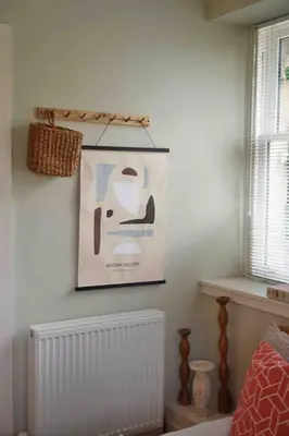 a picture hanging on the wall of a bedroom at Fully licensed studio in peaceful neighbourhood in Edinburgh