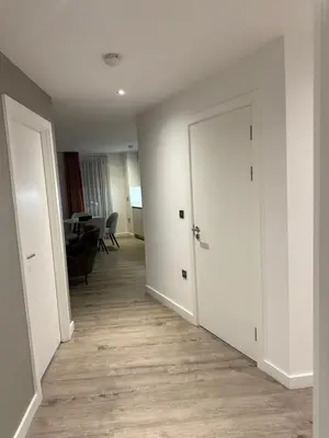 an empty room with a door and a table at Chalk in Moffat