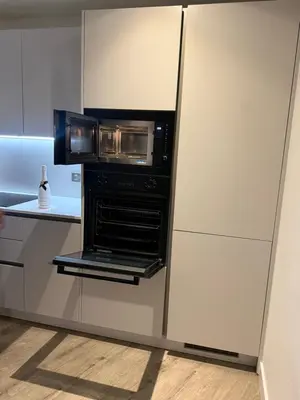 a kitchen with an oven in a wall at Chalk in Moffat