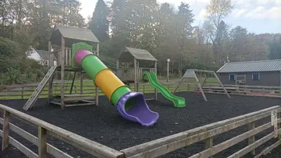 a playground with a slide at Barrhill Holiday Park - Glamping in South West Scotland - Duisk in Girvan