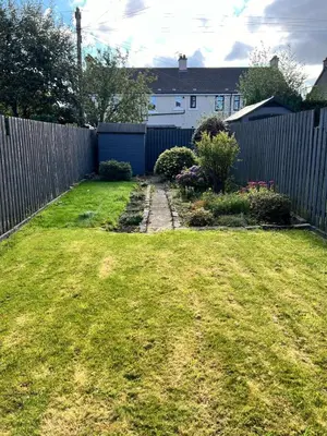 a backyard with a fence and a grass yard at 3BR Sleeps 6 Free Parking Near Glasgow City in Renfrew