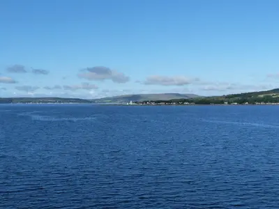 a large body of water with mountains in the background at Serenity Lodge in Wemyss Bay