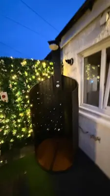 a chair sitting on top of a balcony at night at Welcome to your perfect getaway in Glasgow