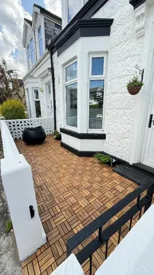 a house with a brick patio in front of it at Welcome to your perfect getaway in Glasgow