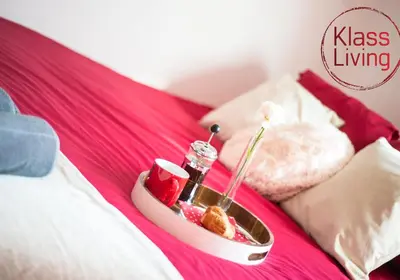 a tray of food sitting on a bed at Kenmar House by Klass Living Hamilton in Hamilton