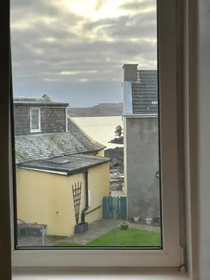 a view of the ocean from a window at Calm of Cumbrae in Millport