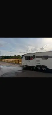 a white trailer parked on the side of a road at 4 berth caravan in Doune