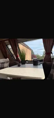 a table with a plant sitting on top of it at 4 berth caravan in Doune