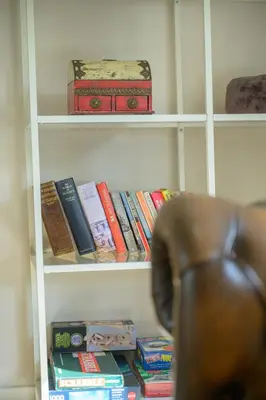 a book shelf filled with books and a bunch thereof at Stylish Stirling home with stunning views in Stirling