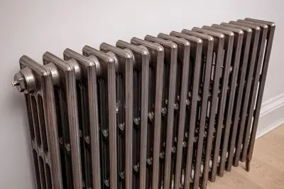 a black radiator sitting next to a wall at Victorian Apartment - city centre - free car space in Edinburgh