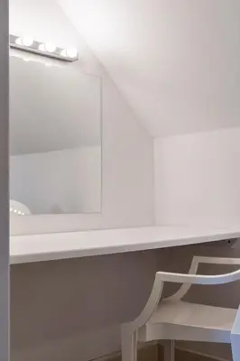 a white desk with a chair in a room at The Clydesider in Glasgow