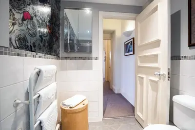 a bathroom with a toilet and a sink at West George Street Apartment Glasgow in Glasgow