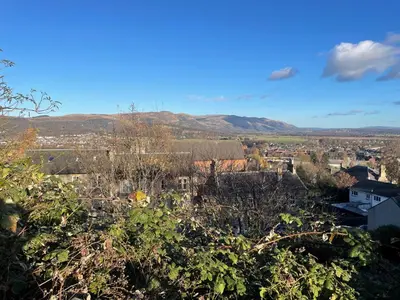 a view of a city with mountains in the background at Hidden Gem in Stirling