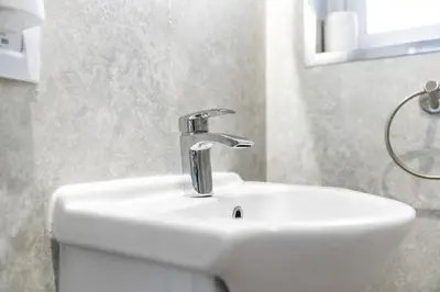 a bathroom sink with a faucet on top of it at O Hill Crescent 1 Bedroom Studio - Edinburgh in Edinburgh