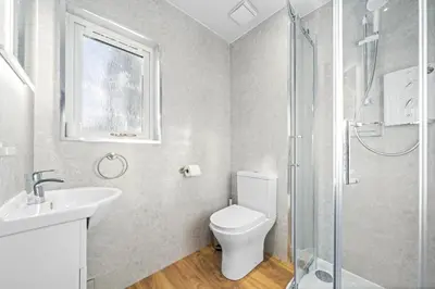 a bathroom with a toilet and a sink and a shower at O Hill Crescent 1 Bedroom Studio - Edinburgh in Edinburgh