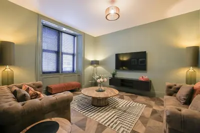 a living room with two couches and a tv at No 4 Burnbank in Oban