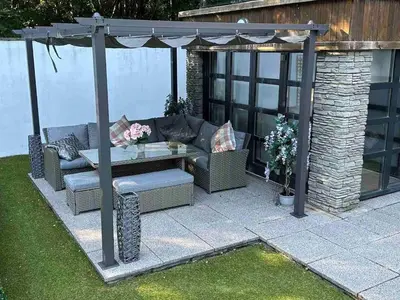 a gazebo with a couch and a table at The Loch Lomond Townhouse In The Centre of Balloch in Balloch