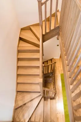 a wooden staircase in a house with wooden floors at The Loch Lomond Townhouse In The Centre of Balloch in Balloch