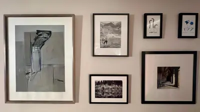 a group of framed pictures on a wall at Spacious, bright home in Central Scotland sleeps 6 in Balfron