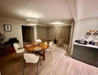 a kitchen and dining room with a table and chairs at Spacious, bright home in Central Scotland sleeps 6 in Balfron