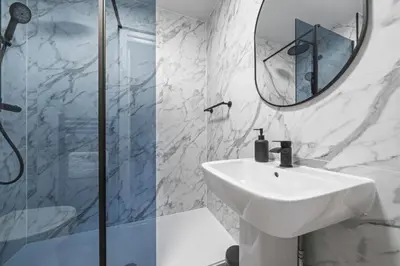 a white bathroom with a sink and a mirror at City-Close 1-Bedroom Apartment - Edinburgh in Edinburgh