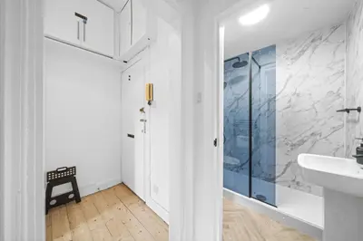 a bathroom with a sink and a glass shower at City-Close 1-Bedroom Apartment - Edinburgh in Edinburgh
