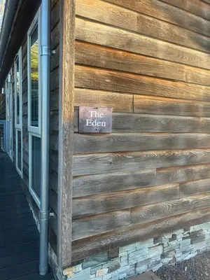 a sign on the side of a building at The Eden, Cosy 1 bed lodge with riverside views in Crieff