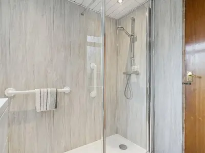 a shower with a glass door in a bathroom at Spacious 2 Bed in Falkirk in Falkirk
