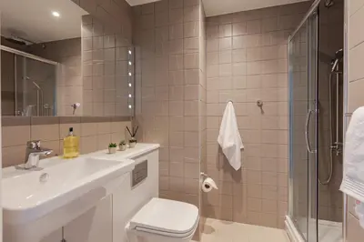 a bathroom with a sink toilet and a shower at For Students Only Stylish Studios in Glasgow in Glasgow