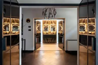 a hallway with a door leading into a room with plates at Near Transport - Hot tub - Fireplace - Sleeps 2 in Edinburgh