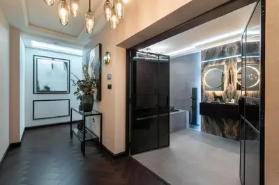 a bathroom with a walk in shower and a glass door at Near Transport - Hot tub - Fireplace - Sleeps 2 in Edinburgh