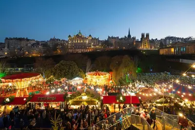 a crowd of people at a christmas market at night at Heart Of Edinburgh City Flat in Edinburgh