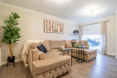 a living room with a couch and a table at Angel House - 3 bedrooms close to Airdrie Centre in Airdrie