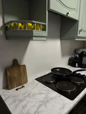 a kitchen counter with a stove top with pans on it at Hydro Secc House Glasgow 10 minute walk in Glasgow