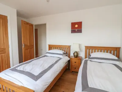 two beds sitting next to each other in a bedroom at Lurach House in Appin