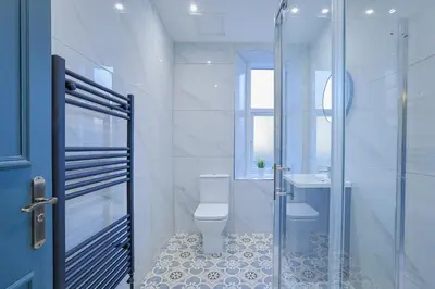 a bathroom with a toilet and a sink at Gordon's Getaway Lux in Oban