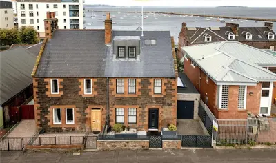 an aerial view of a brick house at Luxury Waterfront Retreat for Groups in Edinburgh